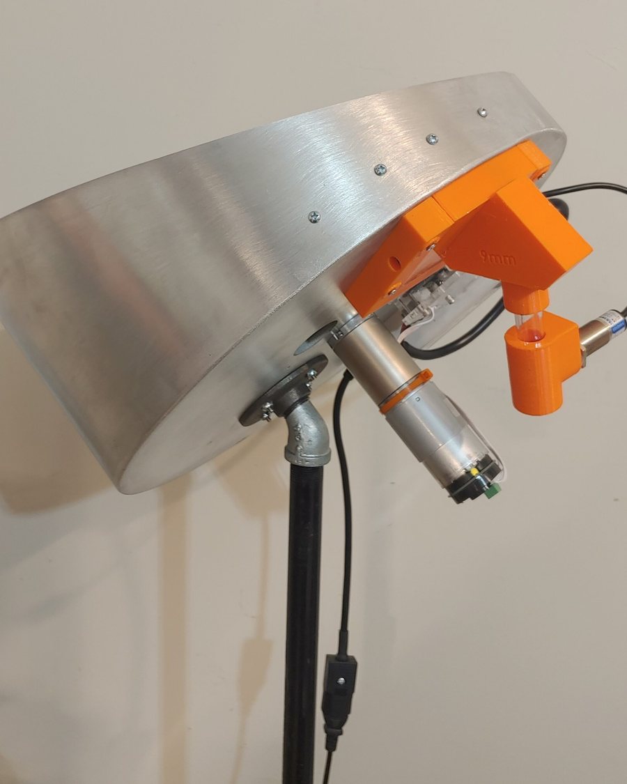 AccuFeed collator bowl with its drive and feed fingers on a mast mount